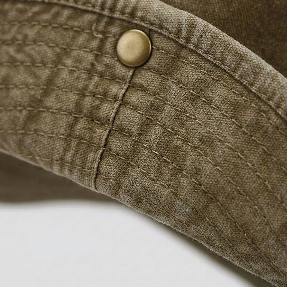 Wide brim outdoor hat with adjustable chin strap and fold-up sides